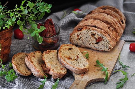 Homemade bread with dried tomatoes and artichokes